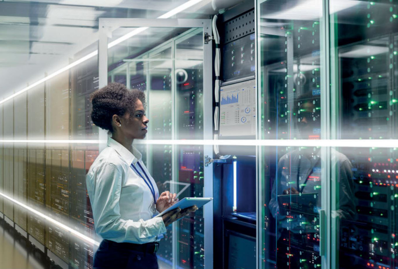 women on tablet in data center