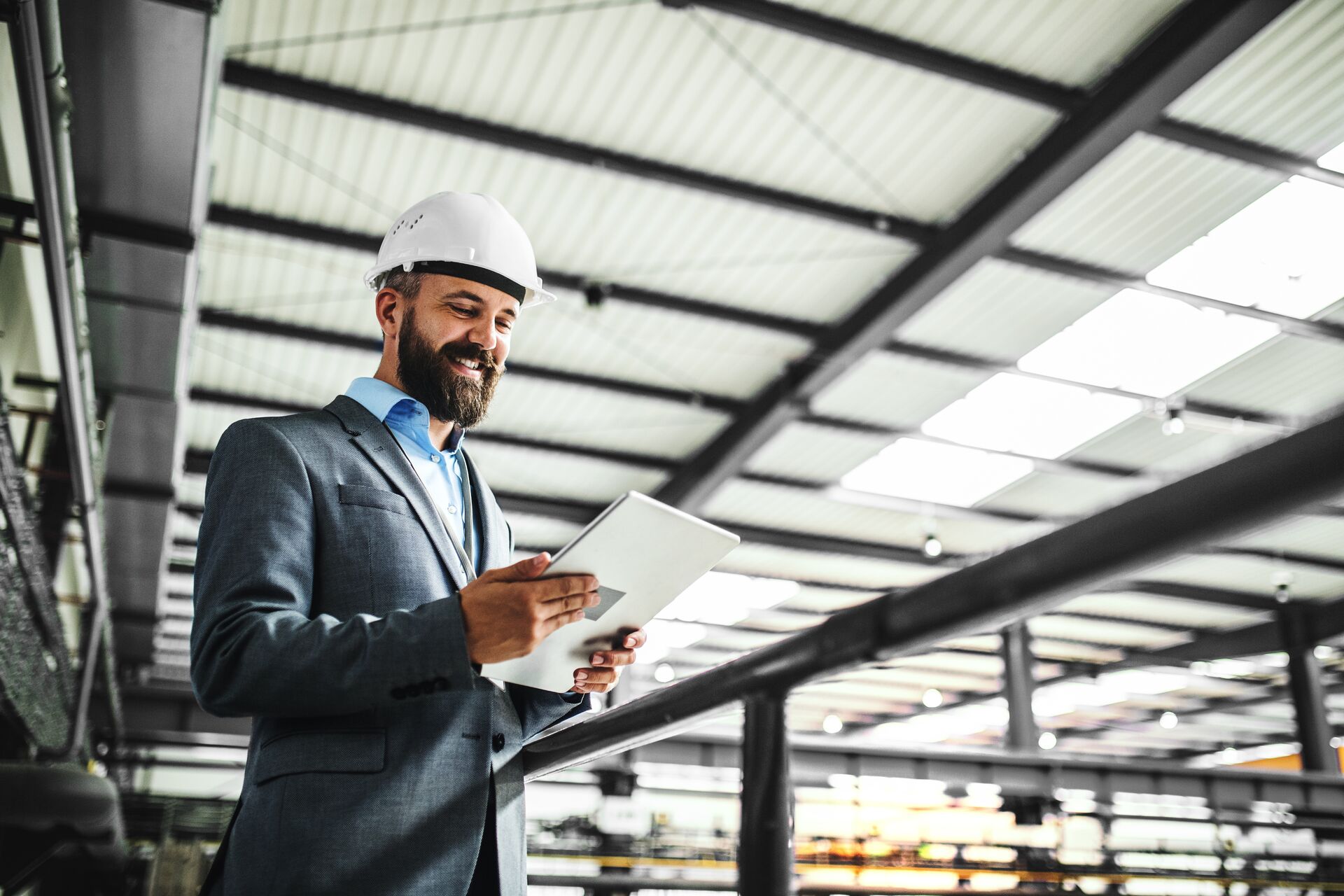Engineer with tablet in a factory